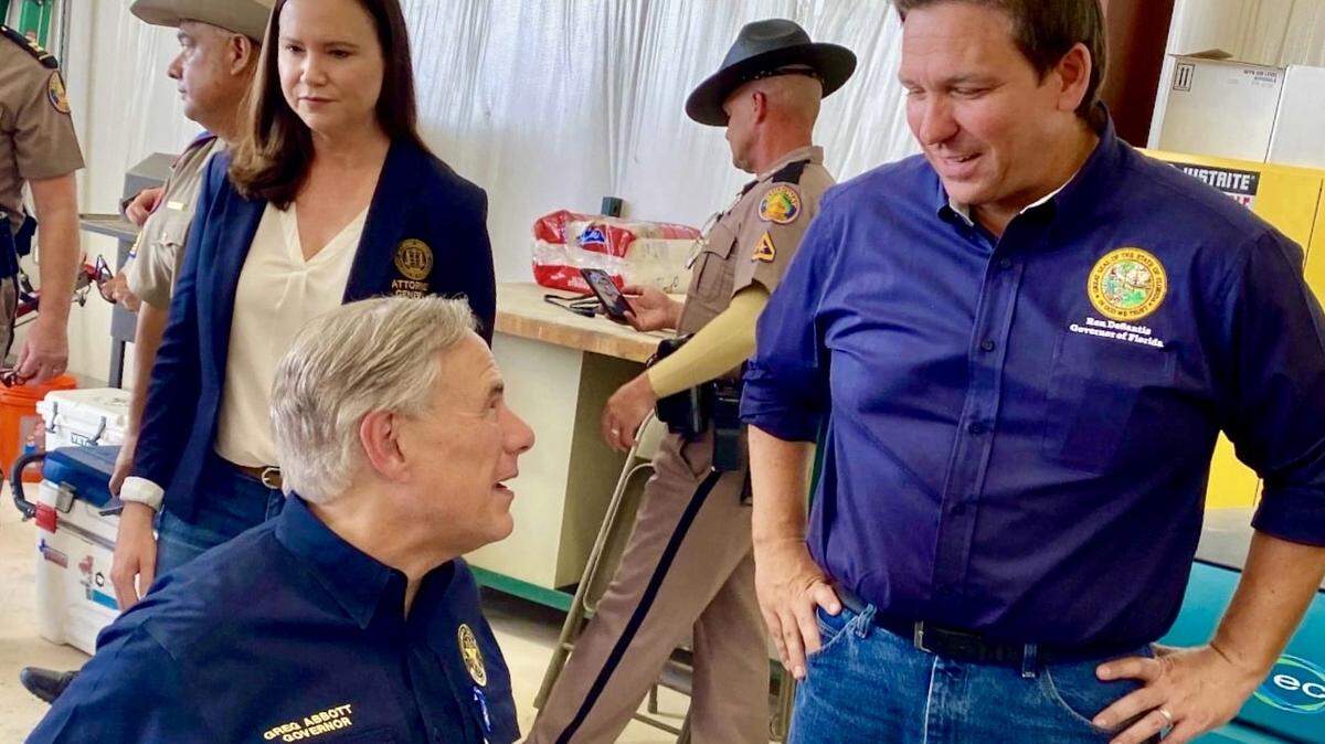 Florida Gov. Ron DeSantis and Texas Gov. Greg Abbott visit Del Rio, Texas, July 17, 2021, in a photo published by Abbott’s campaign.