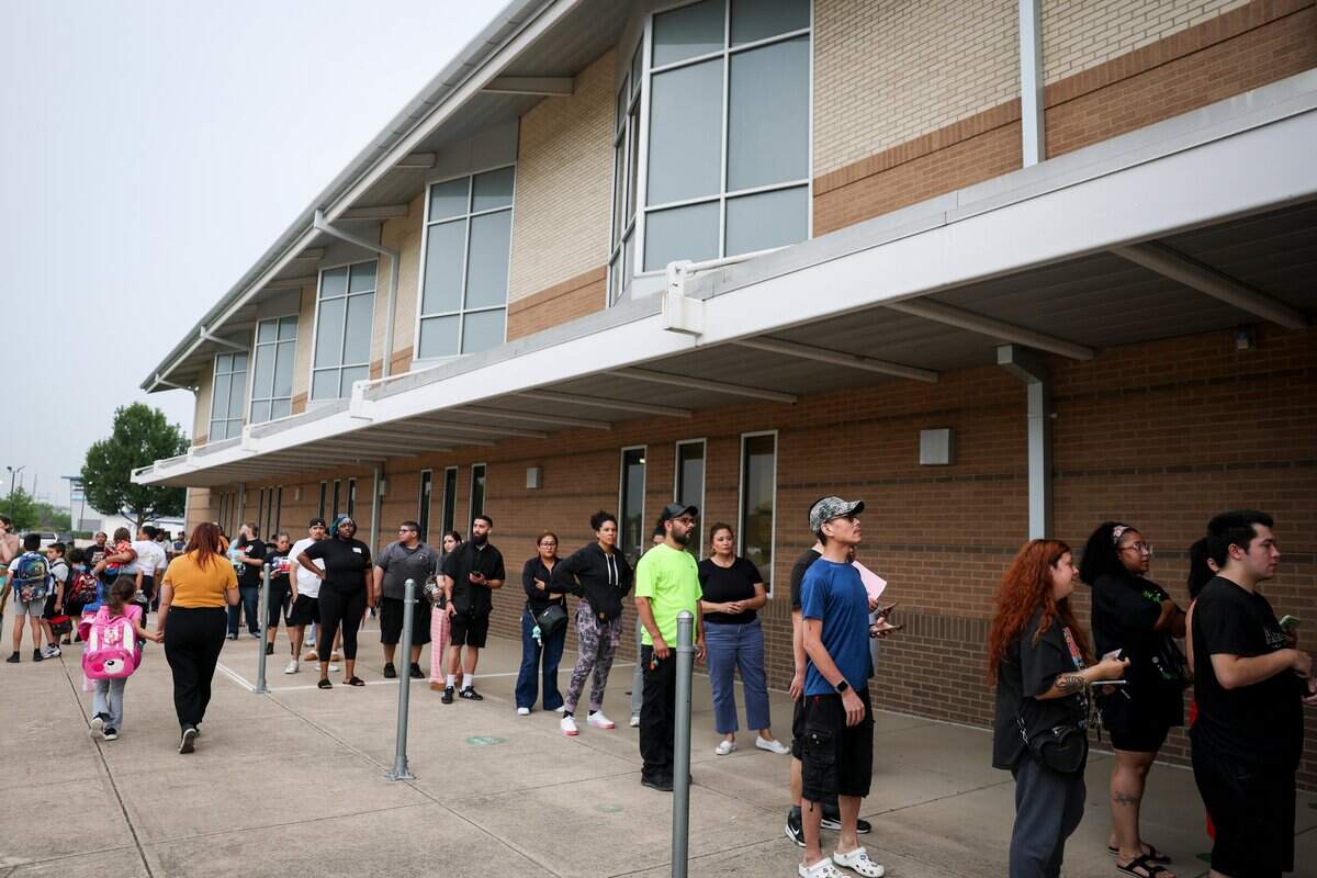 Parents pick up their kids from Basswood Elementary School after the school was on lockdown due to a shooting-incident in a nearby neighborhood on Tuesday, April 28, 2026 in Fort Worth, Texas.