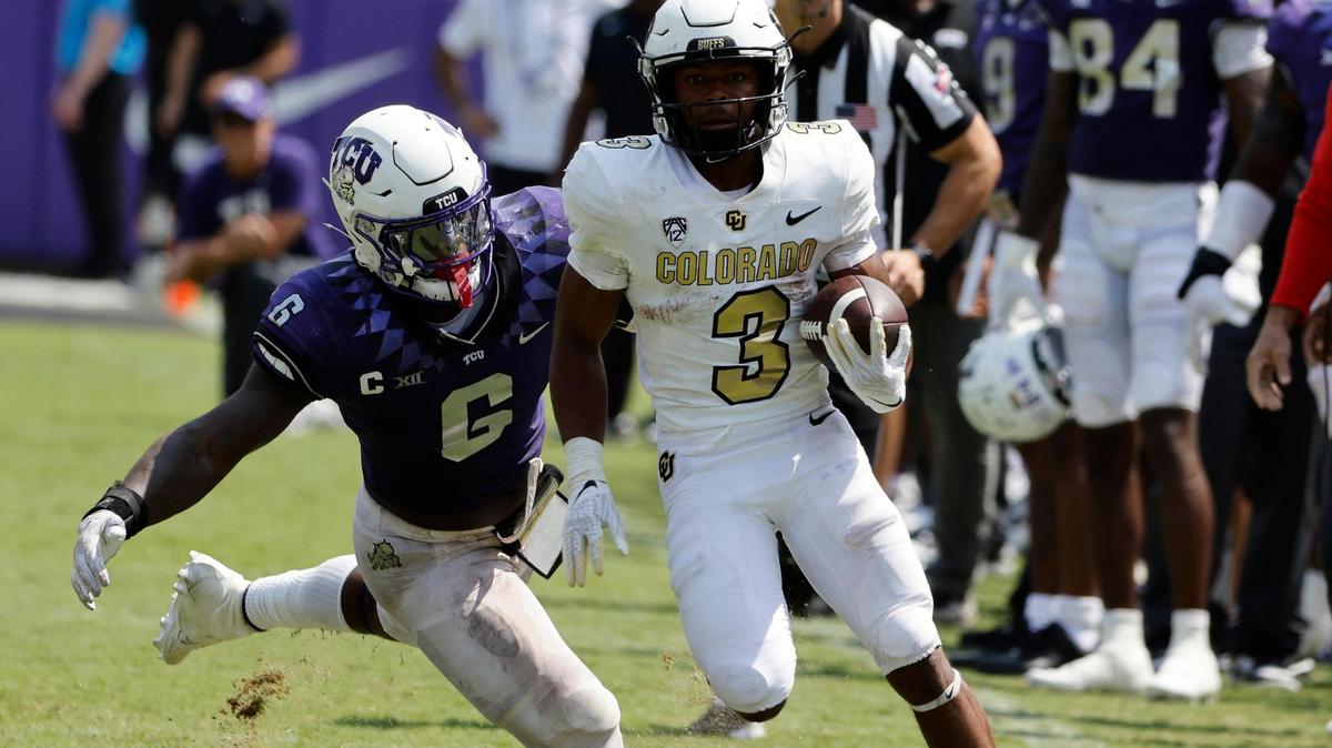 Colorado running back Dylan Edwards outruns TCU linebacker Jamoi Hodge (6) for the winning touchdown before the second half of a NCAA football game at Amon G. Carter Stadium in Fort Worth,Texas, Saturday Sept. 02, 2023. Colorado defeated TCU 45-42. (Special to the Star-Telegram Bob Booth)