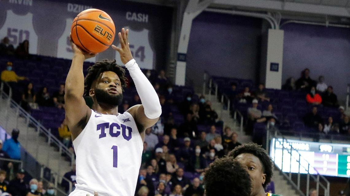 TCU guard Mike Miles (1) shoots over Baylor guard Adam Flagler (10) during the first half of Saturday’s game in Fort Worth. Miles sustained a wrist injury Saturday, but X-rays were negative and he’s not expected to miss any time.