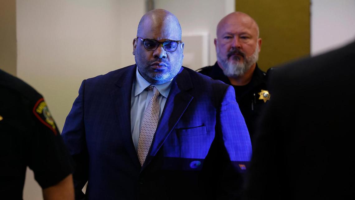 A projector shines on defendant Christopher Turner as he enters the 432nd District Court at the Tim Curry Criminal Justice Center in Fort Worth on Monday, Nov. 4, 2024. Turner is charged with capital murder in the March 2020 shooting death of Anwar Ali.