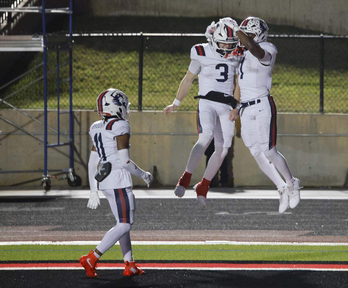 Richland quarterback Brett Kates (3) celebrates the touchdown by running back Jayshon Gibson (1) against Denton Ryan during the first half of a UIL Class 5A Division I Regional on Friday Nov. 28, 2025 at Buddy Echols Field in Coppell, Texas.