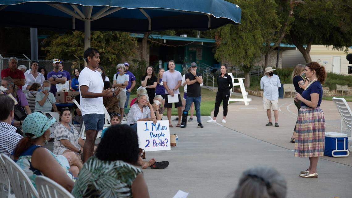 Former TCU swimmer Nathan Losch, standing left, talks with District 9 council member Elizabeth Beck, standing right, how public pools offer both fitness and opportunity to the youth of Fort Worth during a community meeting Thursday about replacing the Forest Park Pool.