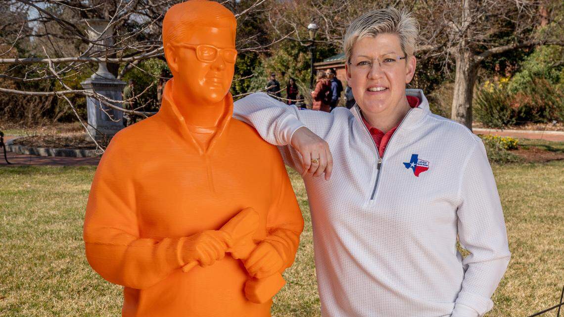 Dallas teacher Jenn Makins stands next to her statue that was on display in March as part of the “Women in STEM” exhibit, the first all-female exhibit at the Smithsonian.