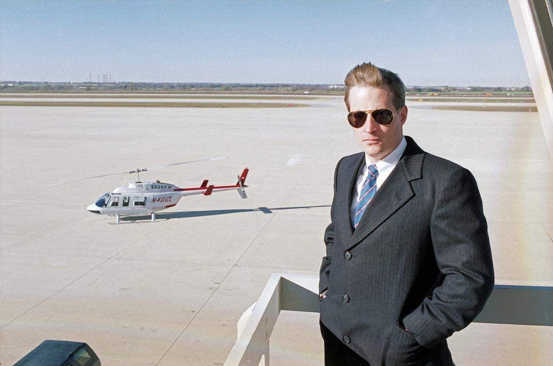 Dec. 5, 1990: Ross Perot Jr. poses at Alliance Airport in Fort Worth with a helicopter in the background.