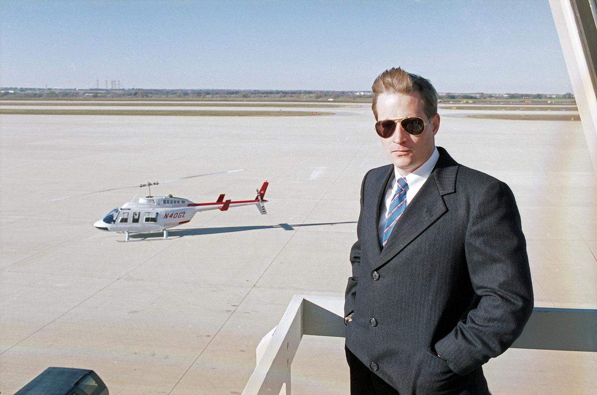 Dec. 5, 1990: Ross Perot Jr. poses at Alliance Airport in Fort Worth with a helicopter in the background.