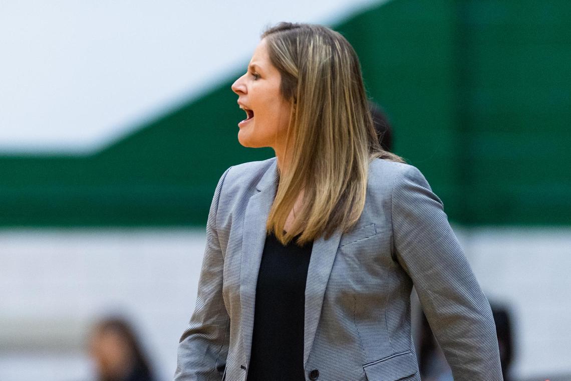 Martin head coach Brooke Brittain coaches her team from the sideline during the 2nd half of the Bi-District game between Arlington Martin and Trinity at Arlington High on February 18, 2020.