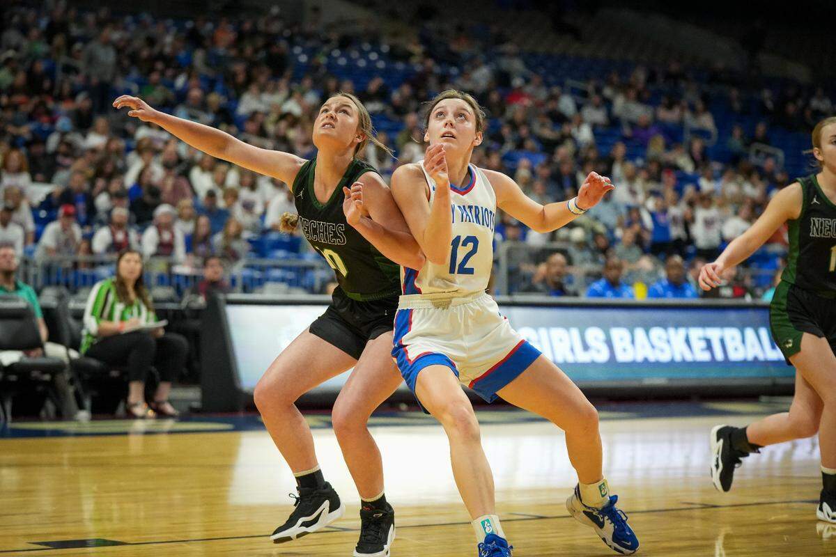 Neches’ Jessi Sumpter (left) and Turkey Valley’s Reese Cruse battle for rebound position in a Class 1A state semifinal on Thursday, February 29, 2024 at the Alamodome in San Antonio, Texas. No. 1 Valley defeated Neches 54-41.