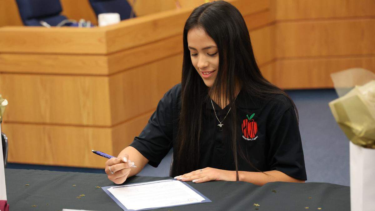 First photo, Anahi Diazdeleon, a 2022 graduate of Chisholm Trail High School, signs a letter-of-intent to return to teach in the Eagle Mountain Saginaw School District as part of the district’s EMS2Teach program.