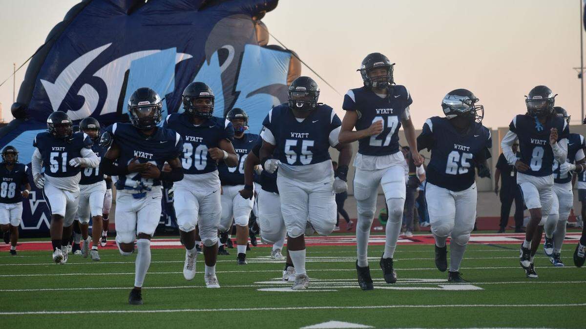 O.D. Wyatt runs onto the field for a high school football game against Chisholm Trail on Thursday, Sept. 11, 2025, at Clark Stadium in Fort Worth, Texas. Wyatt won 30-27.