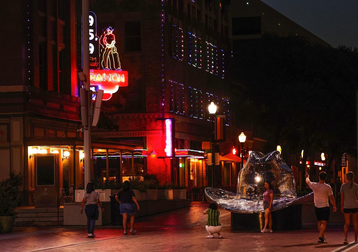 Visitors enjoy Sundance Square Plaza in downtown Fort Worth on Tuesday.