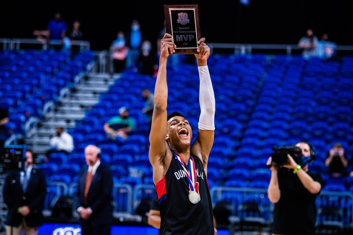 Zhuric Phelps (0) hoists his MVP trophy after Duncanville beat Austin Westlake 66-53 in the 6A state final at the Alamodome in San Antonio Texas, on March 13, 2021. (Photo by Matt Smith. Special to the Star-Telegram).