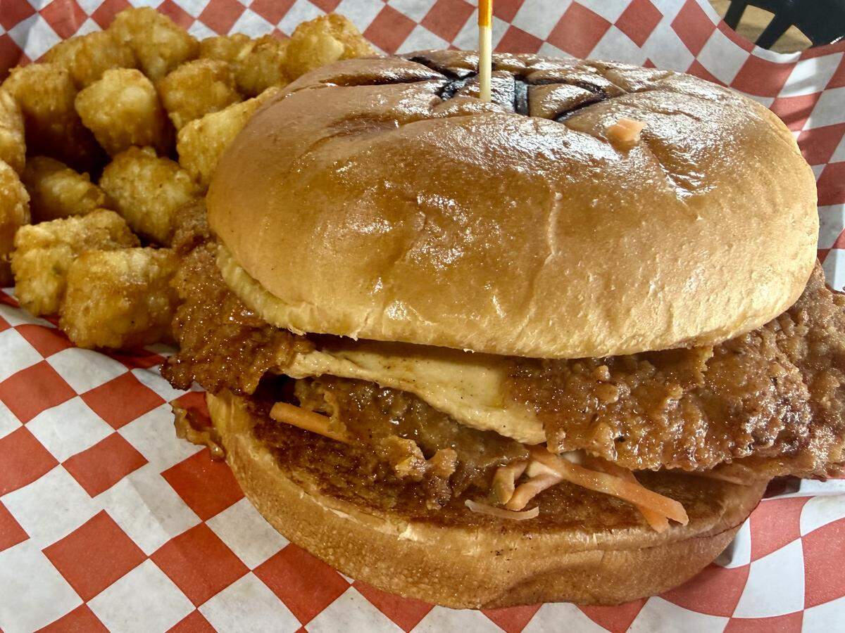The chicken sandwich at Anita’s Kitchen is buttermilk-battered and topped with shredded carrots, relish and spicy mayo, as seen April 9, 2026.