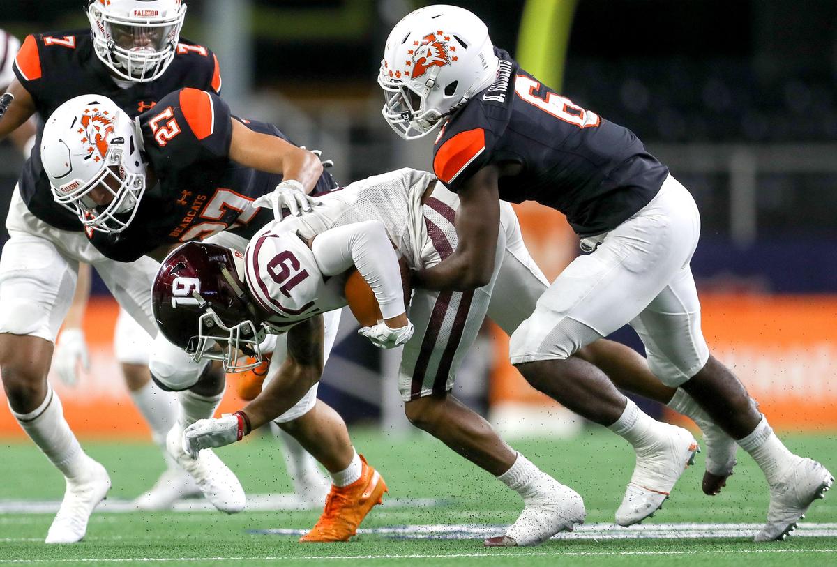 Red Oak wide receiver Coby Cavil (19) comes up with a reception against Aledo defensive back Demarco Roberts (6) and linebacker Nolan Garcia (27) during the first half of their 5A Division II Regional Round High School Football playoff game at AT&T Stadium in Arlington, Tx Friday November 29, 2019.