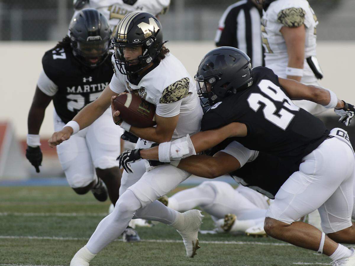 Mansfield’s Mykah Lankford is tackled against Arlington Martin during their on Thursday, September 11, 2025 at Maverick Stadium in Arlington Texas.