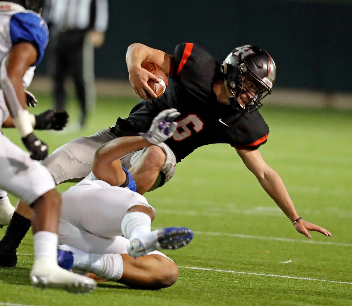 Lake Highlands quarterback Mitch Coulson (6) comes up two yards short of a first down in the first half of a high school bi-district football playoff game at the Gopher-Warrior Bowl in Grand Prairie, Texas, Friday, Nov. 15, 2019. Lake Highlands led 35-19 at the half. (Special to the Star-Telegram Bob Booth)