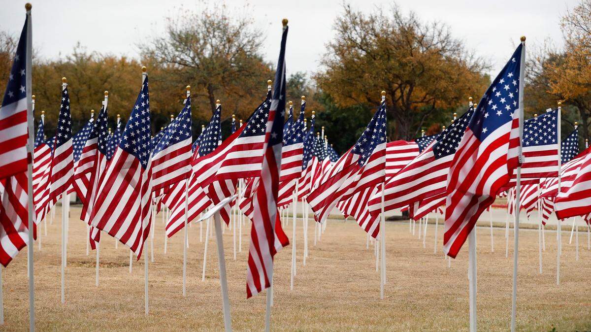 The field beside Keller Town Hall decorated with American flags during a 2019 Veterans Day celebration.