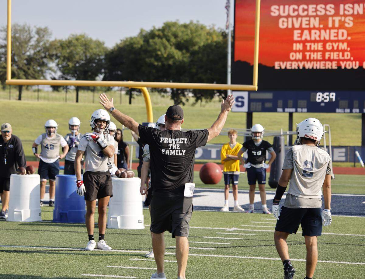 Defensive coordinator Brian Edmonson works with the defensive unit during the first practice of 2025 for the All Saints in Fort Worth, Texas, Tuesday August, 05, 2025.