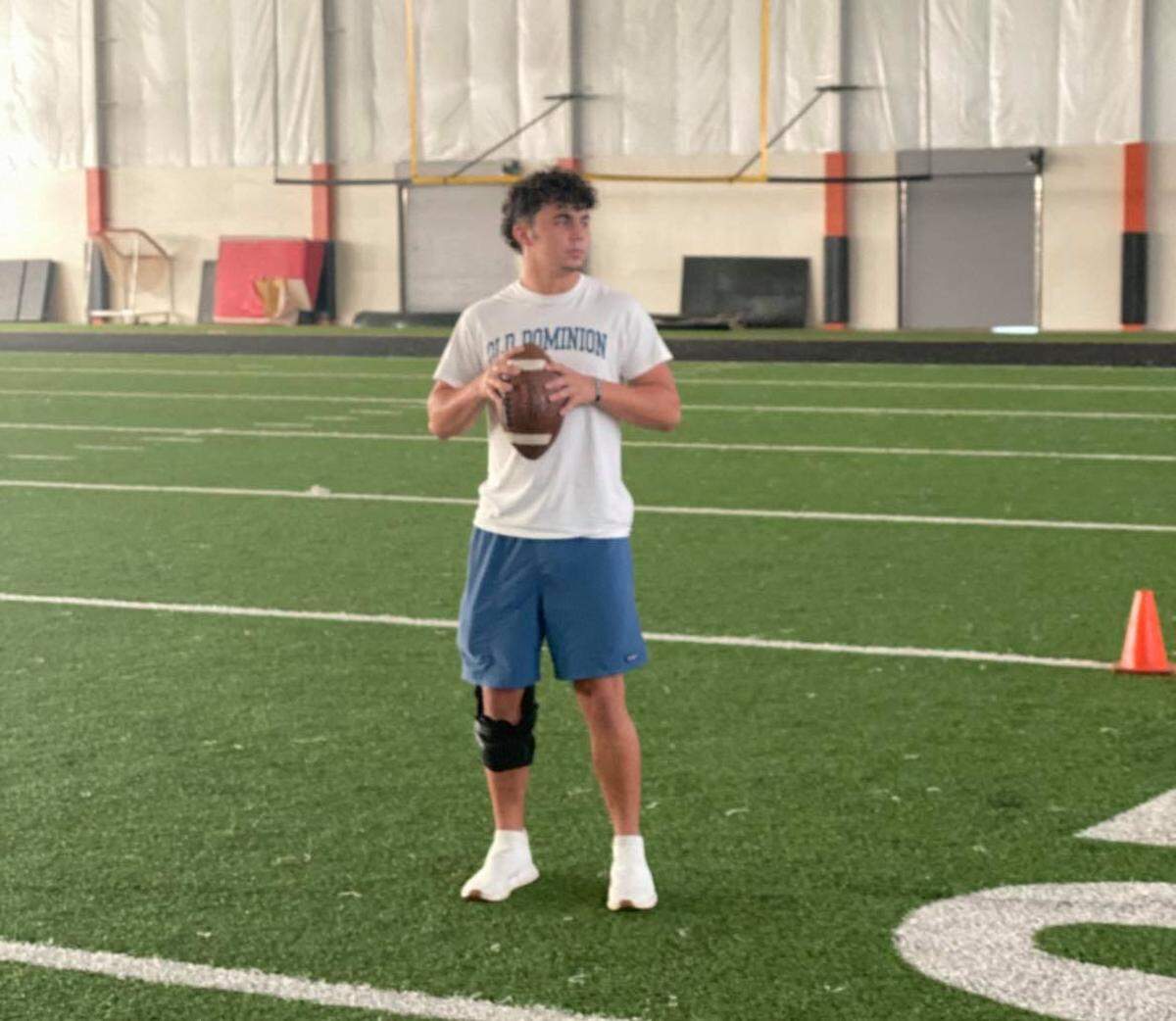 Aledo senior QB Ethan McBrayer practices his throws in the school’s indoor facility. McBrayer returned to the field just nine weeks after tearing his right ACL thanks to stem cell research.