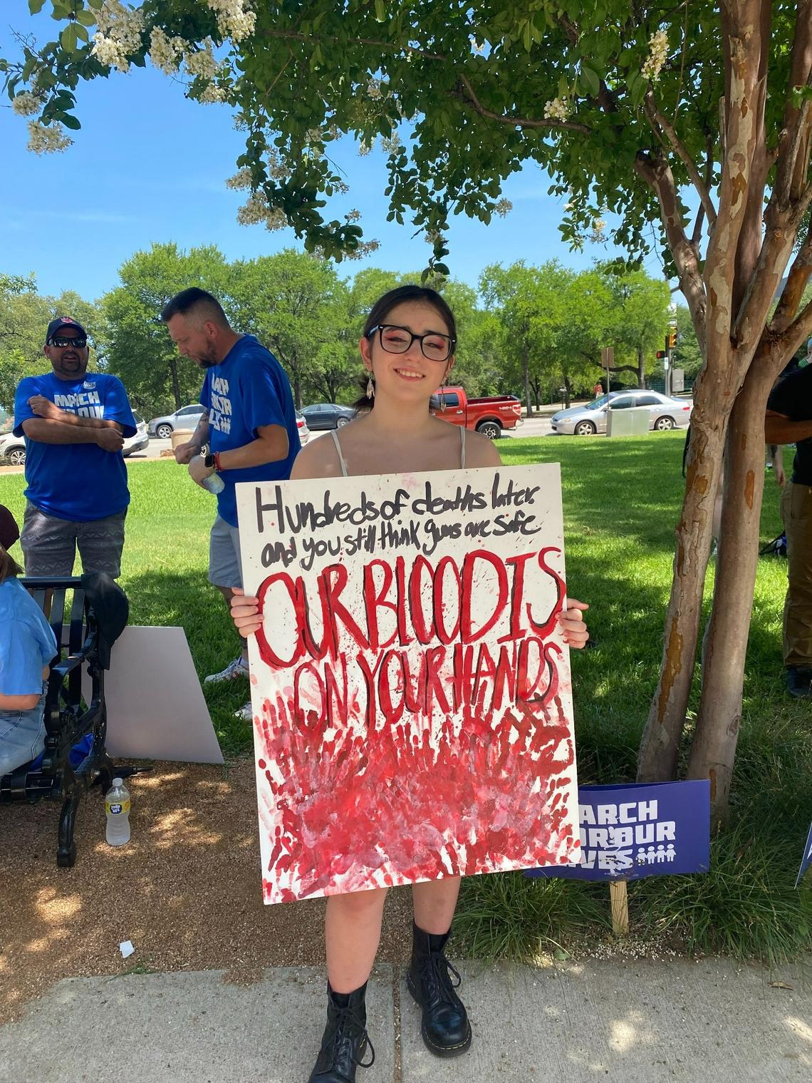 Kamryn McCalister protesting outside the Tarrant County Courthouse Saturday afternoon with March for Our Lives, advocating for gun-reform.
