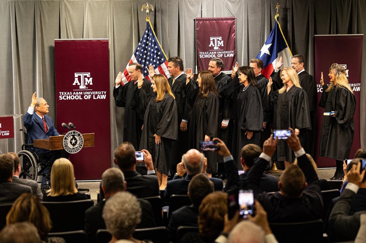 Texas Governor Greg Abbott swears in the 10 Texas Business Courts Justices during an official ceremony at the Texas A&M Law School in downtown Fort Worth on Thursday, Sept. 19, 2024.