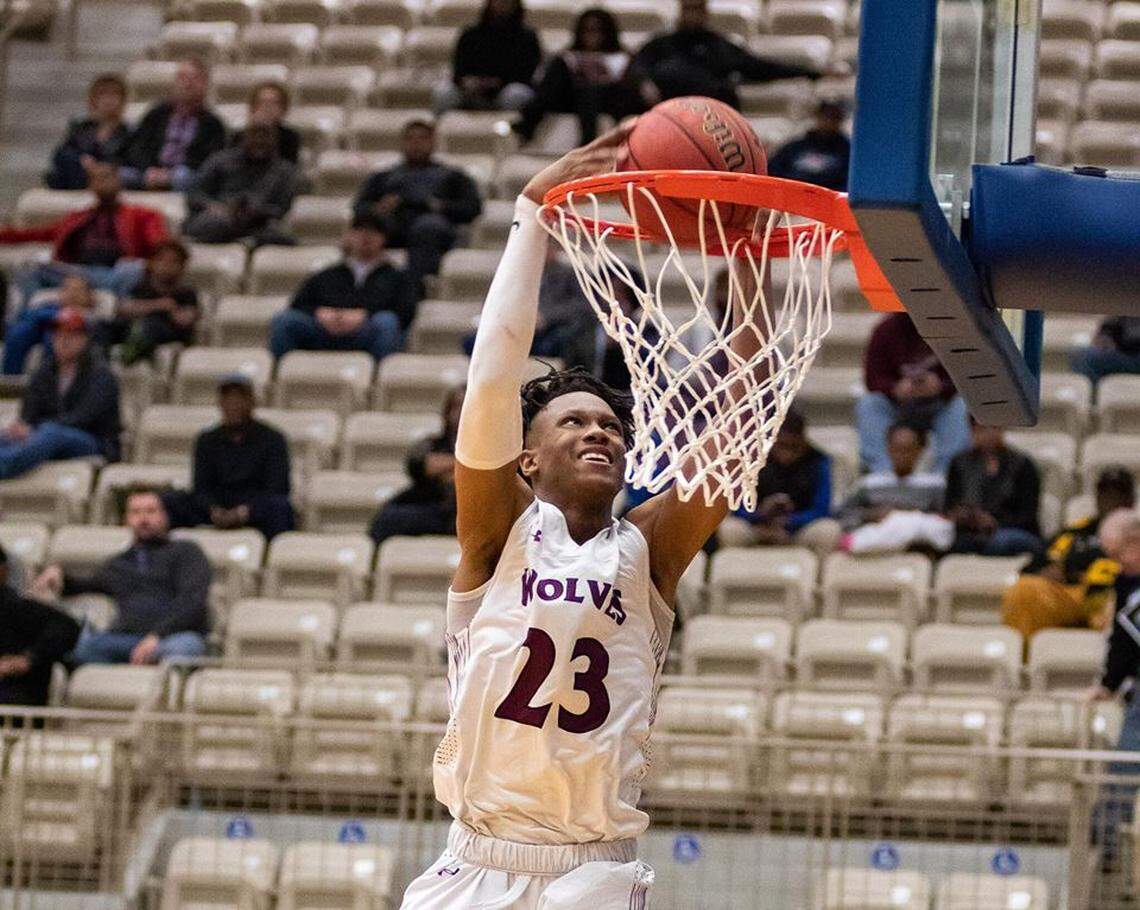 Timberview senior Trazarien White goes for a dunk.