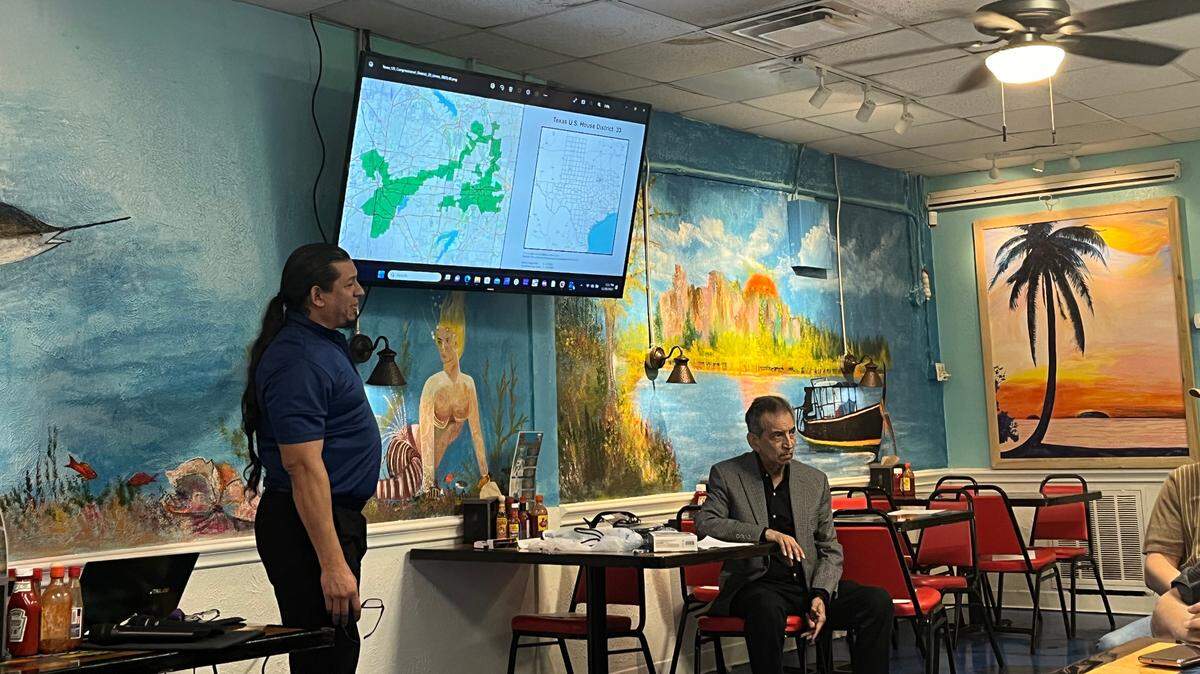 Salvador Carrillo, left, and Hector Carrillo, right, of the League of United Latin American Citizens speak at a meeting in November about a study that shows Black taxpayers are more likely to be audited by the IRS than others. The meeting was held at Mariscos Sonorac restaurant in Fort Worth.