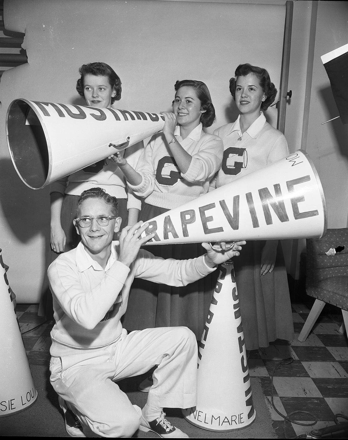 Nov. 17, 1953: “Titled ‘YELL LEADERS,’ pictured here are the five Grapevine students in charge of directing the cheering section at high school football games. They are, from left to right, standing, Jessie Lou Hall, Wanda Tillery, Nelmarie Shofner. Allison Thomas kneels. Sherly Jo Gay, the fifth leader, is not pictured.”