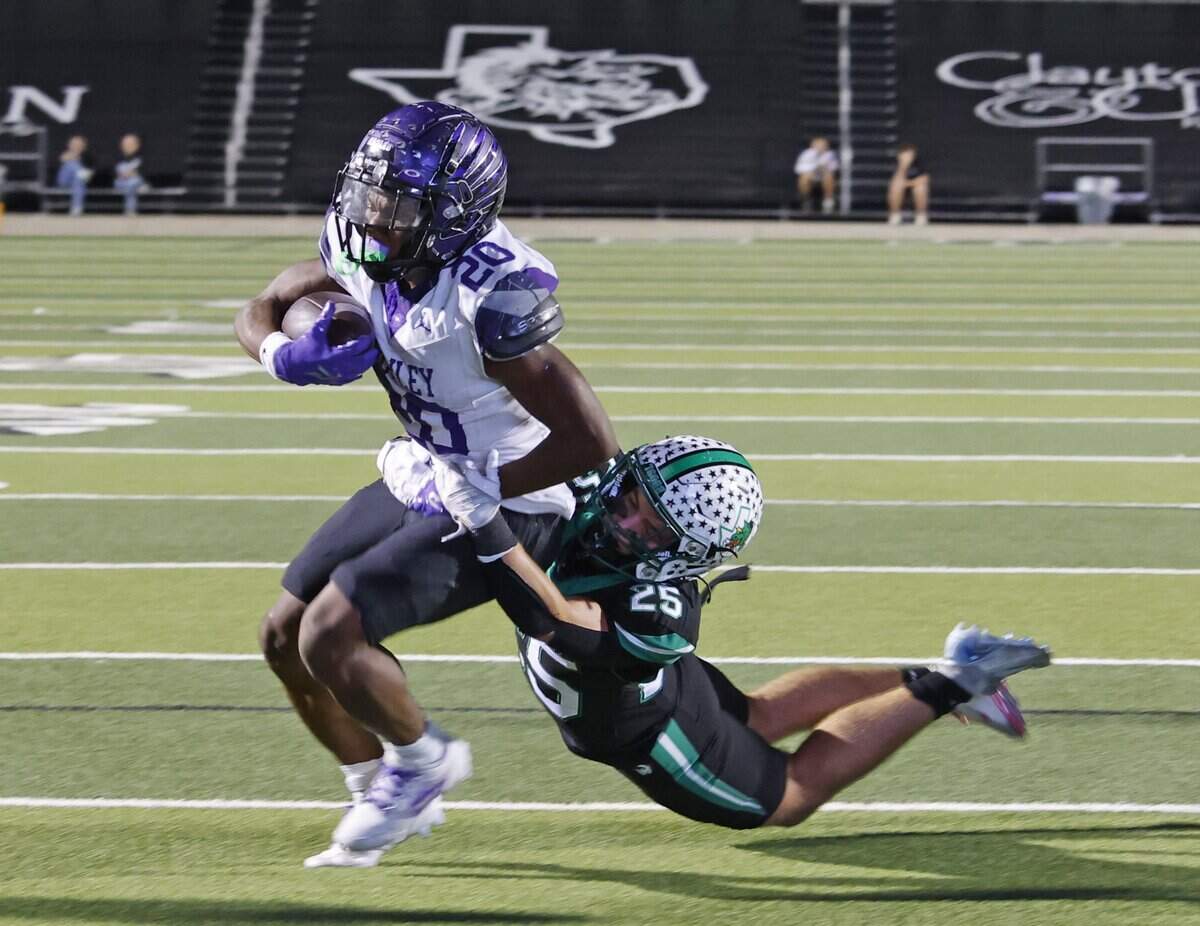 Southlake defensive back Gavin Strange (25) brings down Crowley running back Kenyen Cotton (20) on the one-yard line during the second half of a UIL Conference 6A D2 Bi-District playoff game between Crowley and Southlake Carroll at Dragon Stadium in Southlake, Texas, Thursday, Nov. 13, 2025.