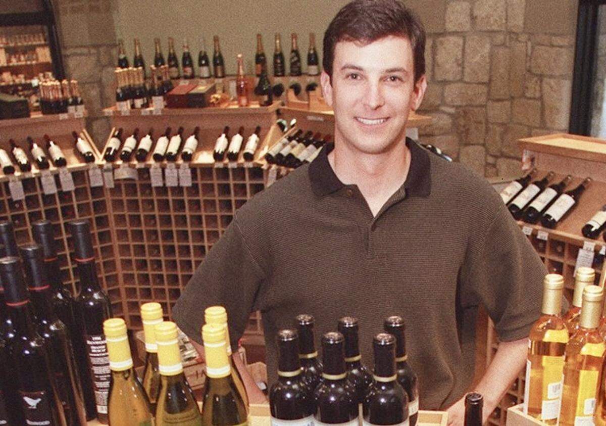 Craig Goldman, son of the owner of Ronnie’s, poses Oct. 9, 2001, with some of the wines his family offered in the gourmet food and wine shop.