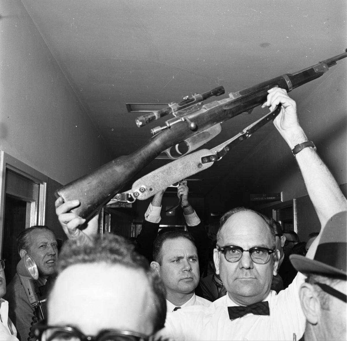 Nov. 22, 1963: Dallas crime lab detective J.C. Day with rifle found at Texas School Book Depository building used to killed President John F. Kennedy.