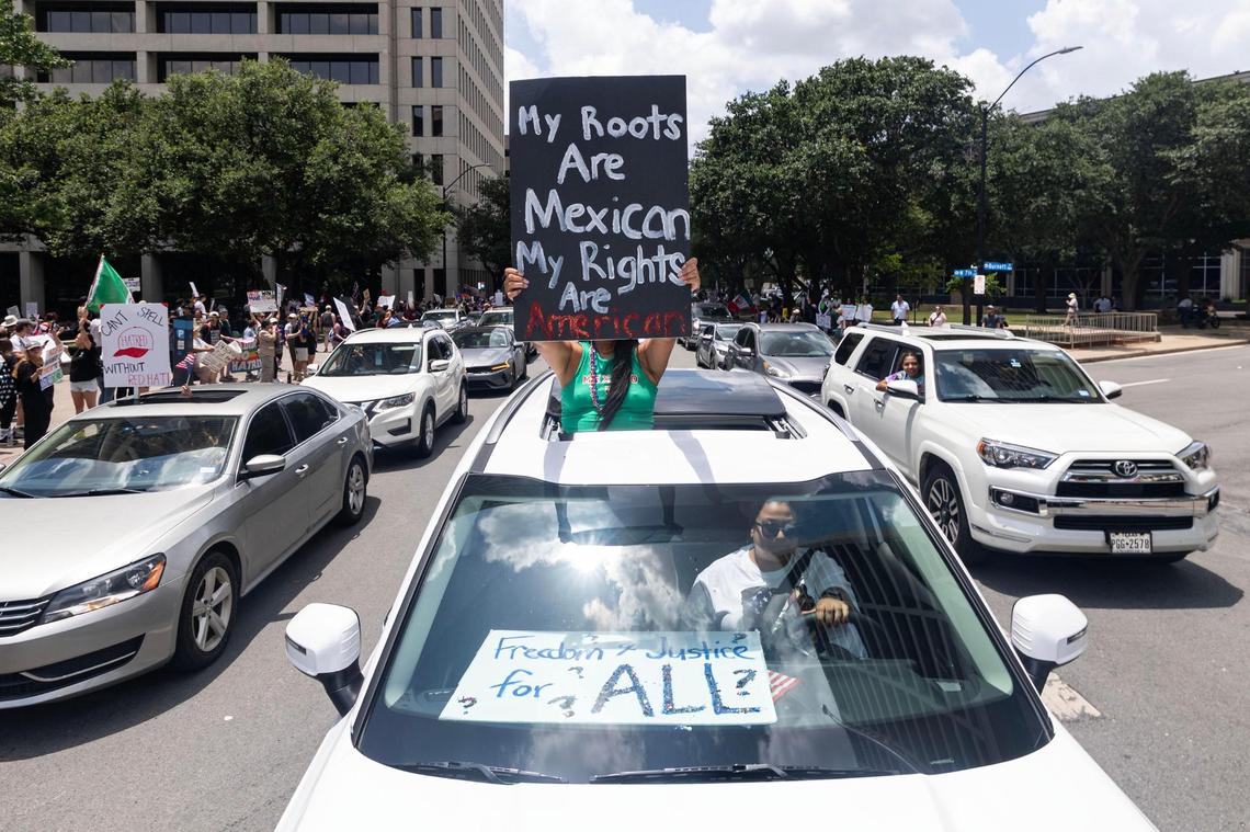 Community members rally during the “No Kings Day” protest in downtown Fort Worth on June 14, 2025.