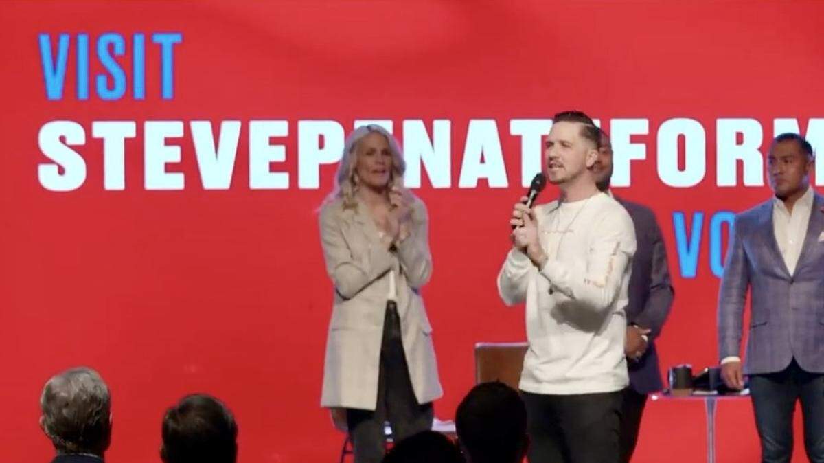 Mercy Culture Church pastors Heather and Landon Schott preached in April 2021 in front of a giant ad for mayoral candidate Steve Penate, right.