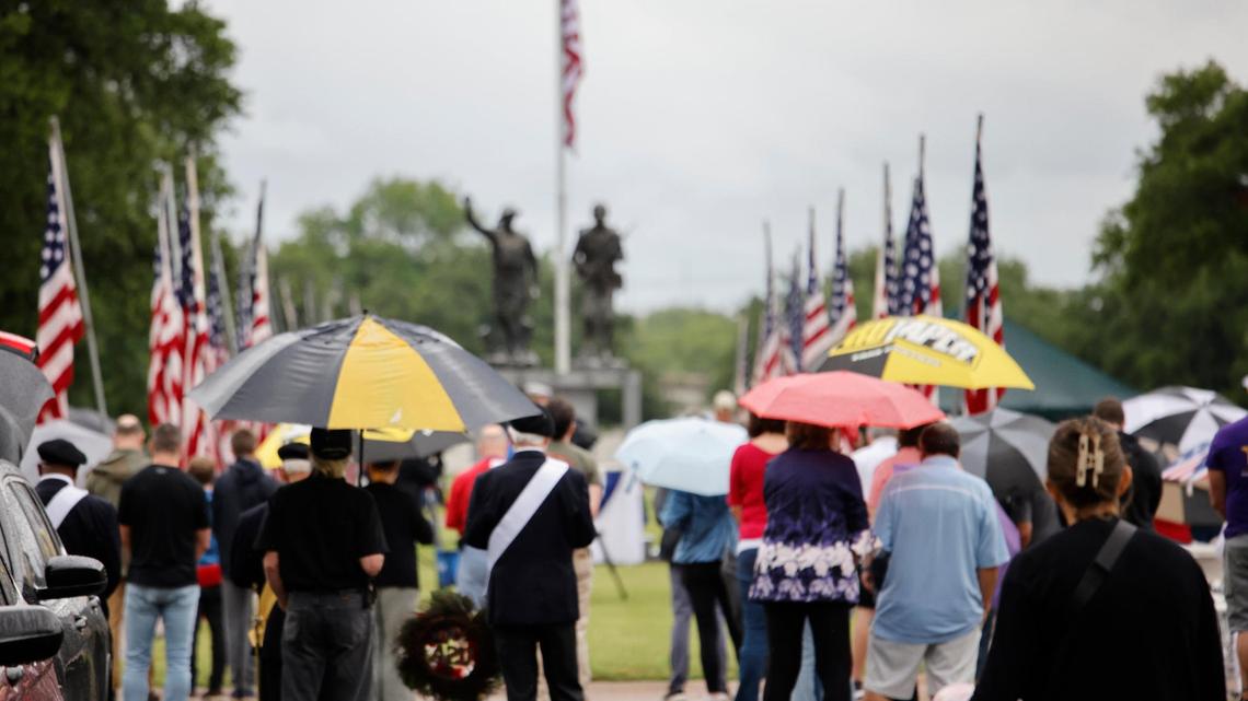People braved the light rain to attend the 96th Fort Worth Memorial Day Service at Mount Olivet Cemetery in Fort Worth, Texas, Monday, May 26, 2025.