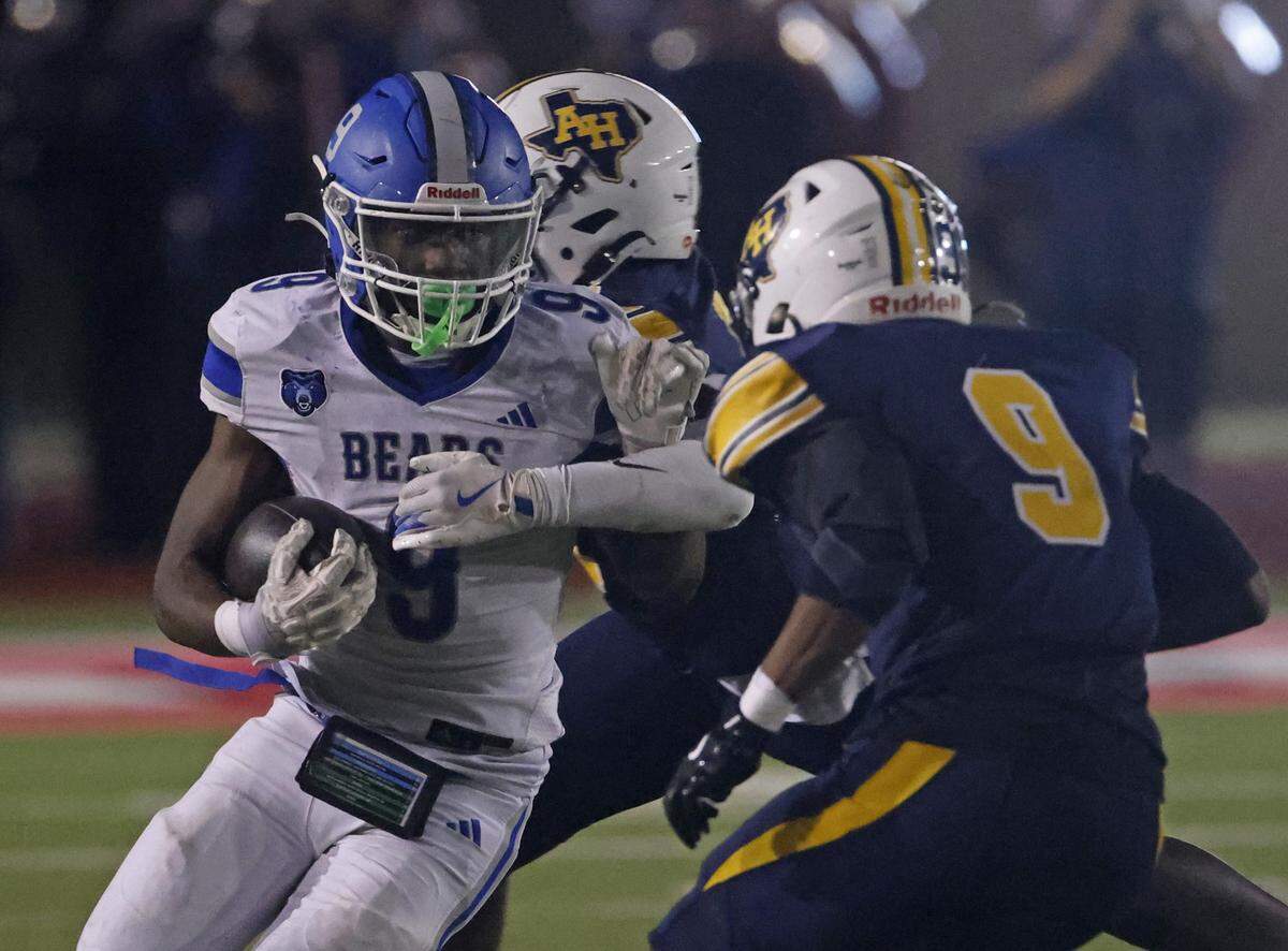 Brewer running back Kameron Coleman (9) runs into the defense of Arlington Heights linebacker Joe Johnson (9) during the first half of a UIL Conference 5A D1 Bi-District playoff game between Arlington Heights and Brewer at Farrington Field in Fort Worth, Texas, Friday, Nov. 14, 2025.