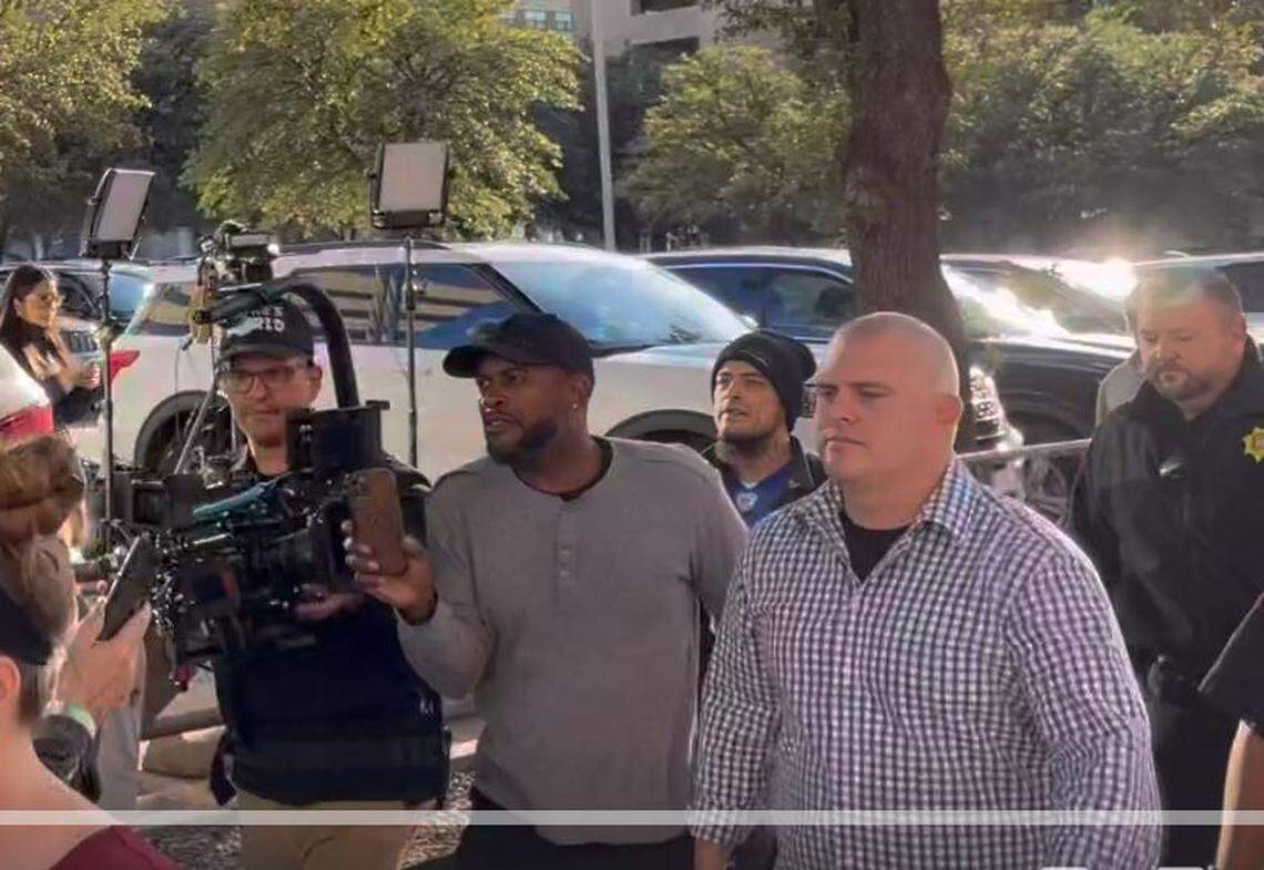 Video on Thursday shows a group yelling at Aaron Dean’s family as they were leaving the courtroom, including a man who appears to be activist Manuel Mata wearing a beanie hat in this screenshot.