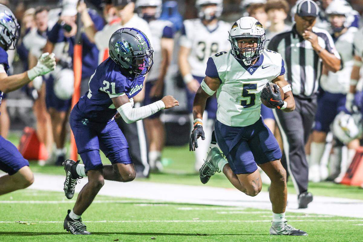 Keller running back Quintin Shropshire (5) runs past Eaton’s Carl Jones at Northwest ISD Stadium in Justin, Texas, Friday, Nov. 7, 2025.