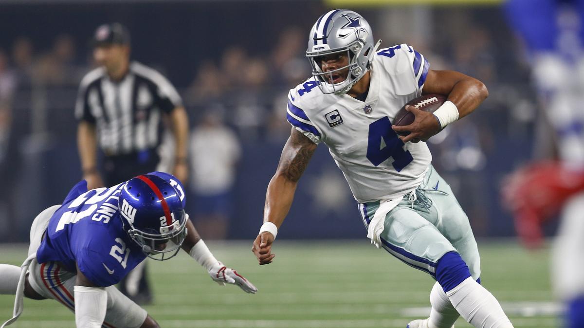 Dallas Cowboys quarterback Dak Prescott (4) rushes past New York Giants defensive back Landon Collins (21) during the first half of an NFL football game, Sunday, September 16, 2018, at AT&T Stadium in Arlington, Texas. (Special to the Star-Telegram/Jim Cowsert)
