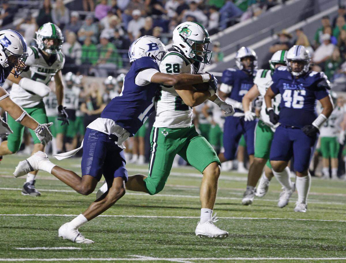 L.D. Bell defensive back Lawrence Dunbar (13) stops Southlake running back Harrison Phillips (28) at the one yard line to end the game in the second half of a UIL football game between Carroll and L.D. Bell at Pennington Field in Bedford, Texas, Friday, October, 24, 2025.