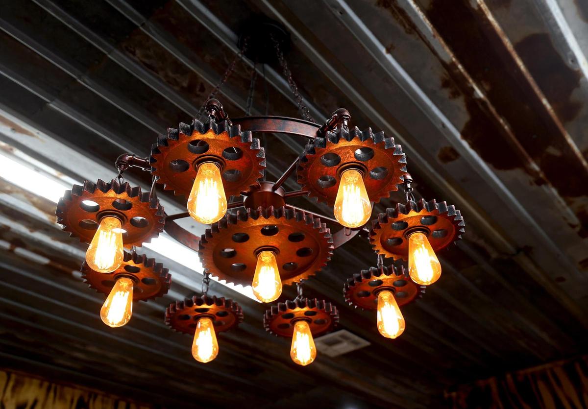 An industrial-inspired chandelier in the tack room of the barn at 270 Price Lane in Weatherford.