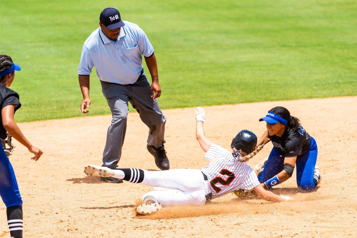 Maddy Jarvis sliding into 2nd and tagged out during the 5A UIL State Softball semifinal between Aledo and Georgetown in Austin Texas, on June 3rd, 2021.