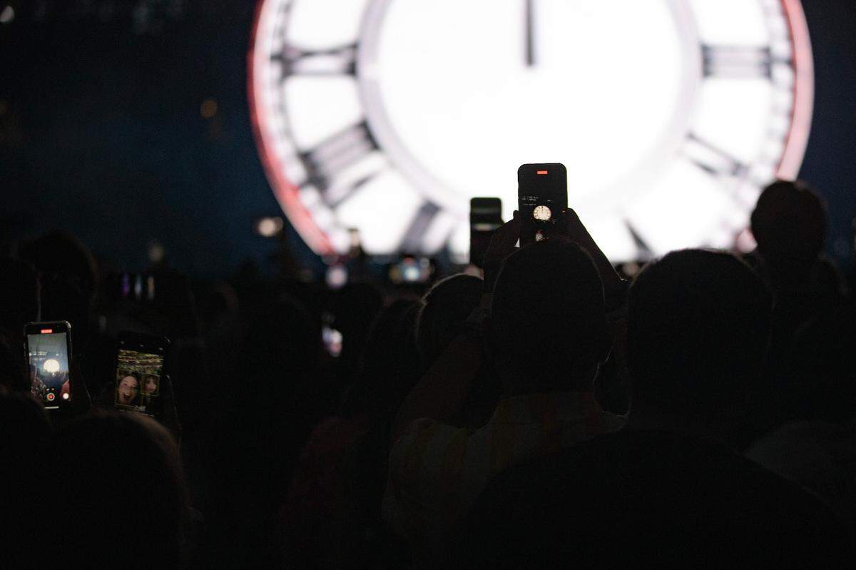 Fans record as seconds remain in the countdown for Taylor Swift’s performance during her first sold-out concert of three nights at AT&T Stadium in Arlington on Friday, March 31, 2023.