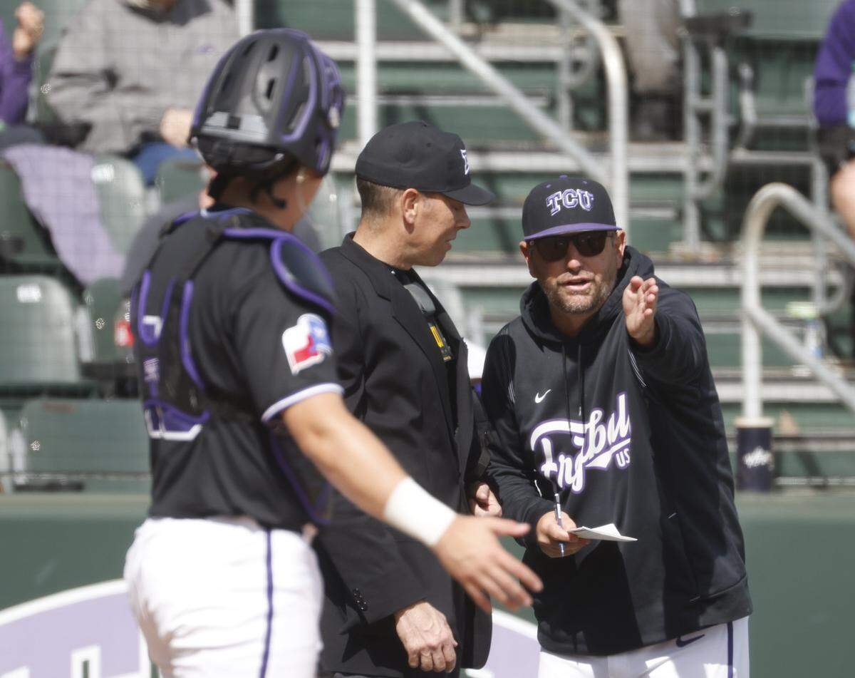TCU head coach Kirk Saarloos has a few words with the home plate umpire during an NCAA baseball game against New Mexico State at Lupton Field at TCU in Fort Worth, Texas, Tuesday, March, 17, 2026.