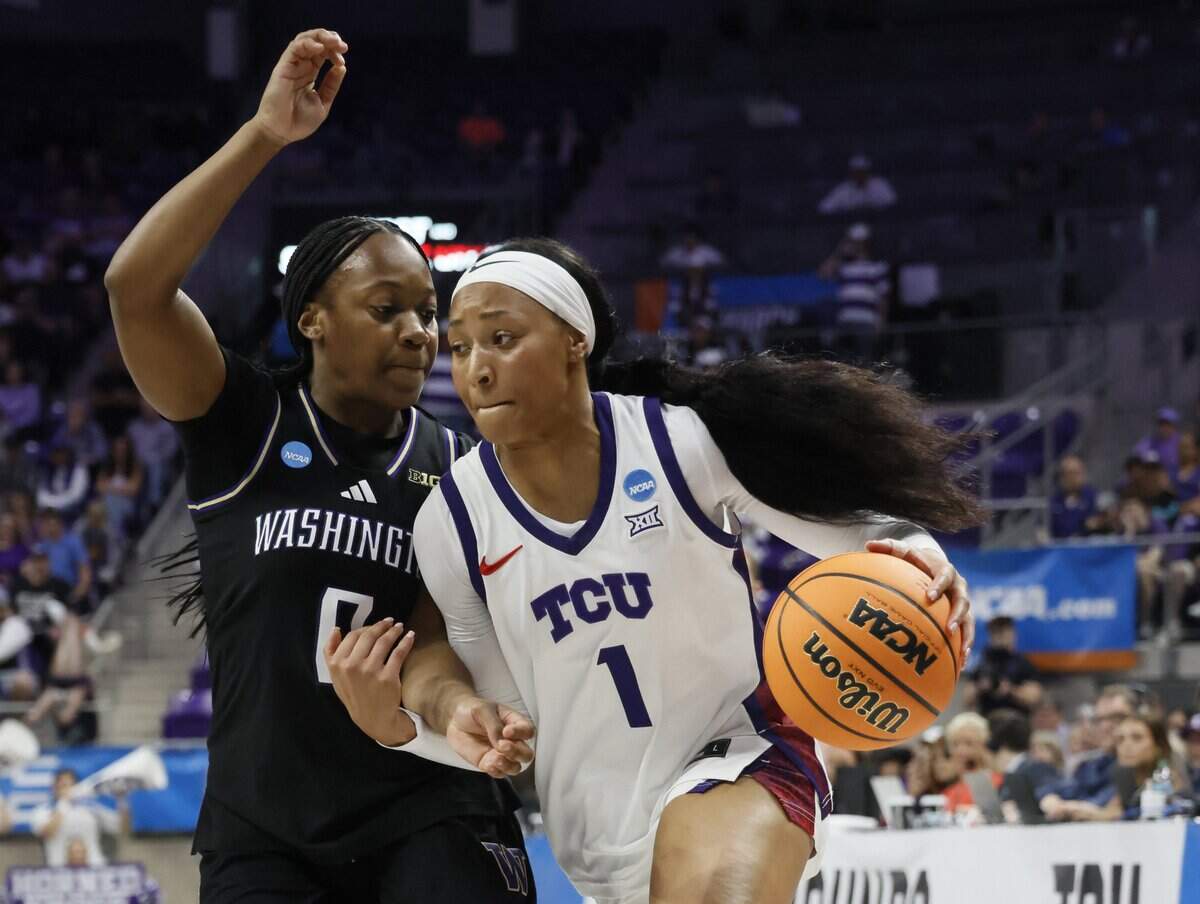 TCU guard Taylor Bigby (1) drives hard against Washington guard Sayvia Sellers (0) during the first half of a second round NCAA Division I Women's Basketball Championship game at Schollmeier Arena in Fort Worth, Texas, Sunday, March, 22, 2026.