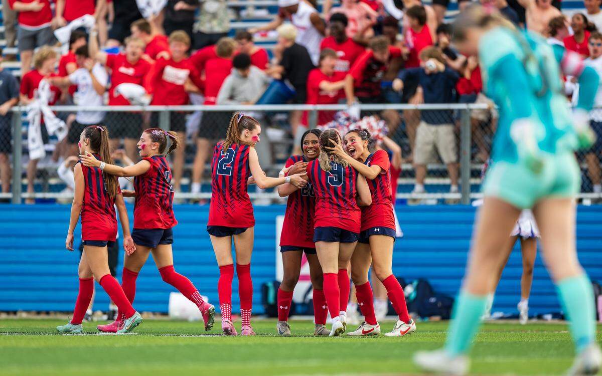 Grapevine’s Maddison Patton (9) is congratulated by her teammates after scoring a goal against Montgomery Lake Creek in the UIL Class 5A Division II state soccer championship game on Friday, April 10, 2026, at Birkelbach Field in Georgetown, Texas.