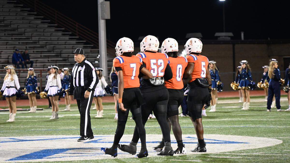 Arlington Bowie’s captains walk out for a Class 6A D2 bi-district matchup at Wilemon Field in Arlington against Dallas Jesuit on Friday, Nov. 15, 2024.