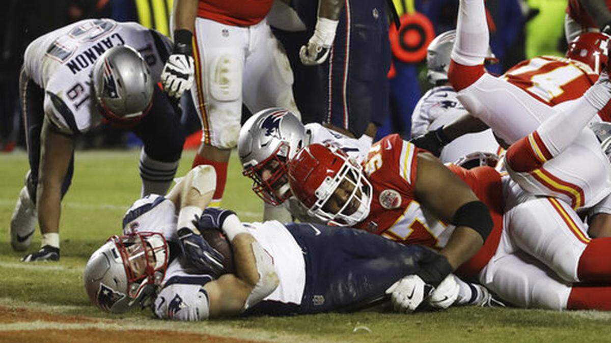 New England Patriots running back Rex Burkhead (34), who went to Plano High School, dives to the end zone for a touchdown to win the AFC Championship NFL football game against the Kansas City Chiefs in overtime, Sunday, Jan. 20, 2019, in Kansas City, Mo. (AP Photo/Elise Amendola)