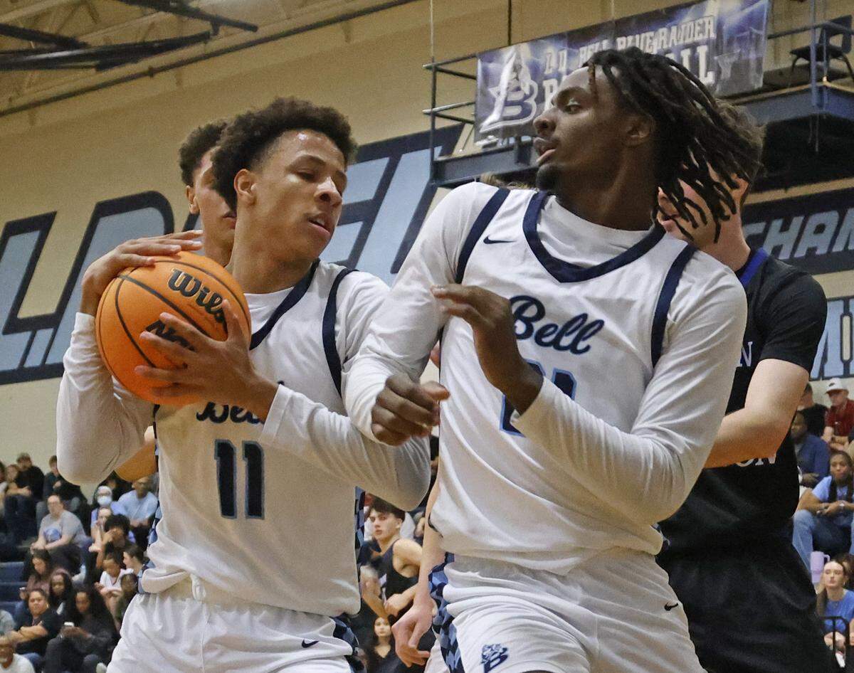 L.D. Bell guard Roman Washington (11) grabs an offensive rebound next to team mate forward Imani Reynolds (21) against Byron Nelson during the first half of a boys UIL basketball game between Byron Nelson and L.D. Bell at L.D. Bell High School in Hurst, Texas, Friday Feb. 06, 2026