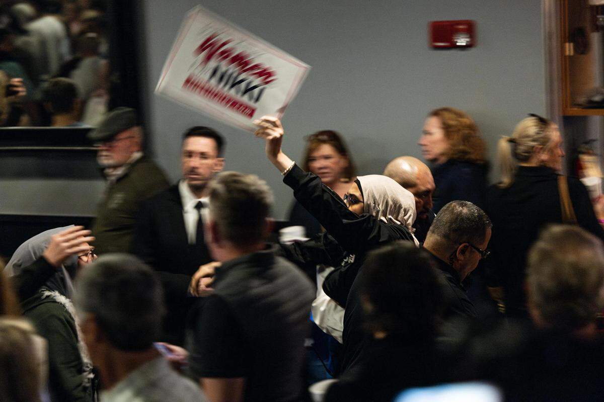 A pro-Palestine protester is escorted out of Republican presidential candidate Nikki Haley’s presidential campaign rally at the Southside Music Hall in Dallas on Thursday, Feb. 15, 2024.