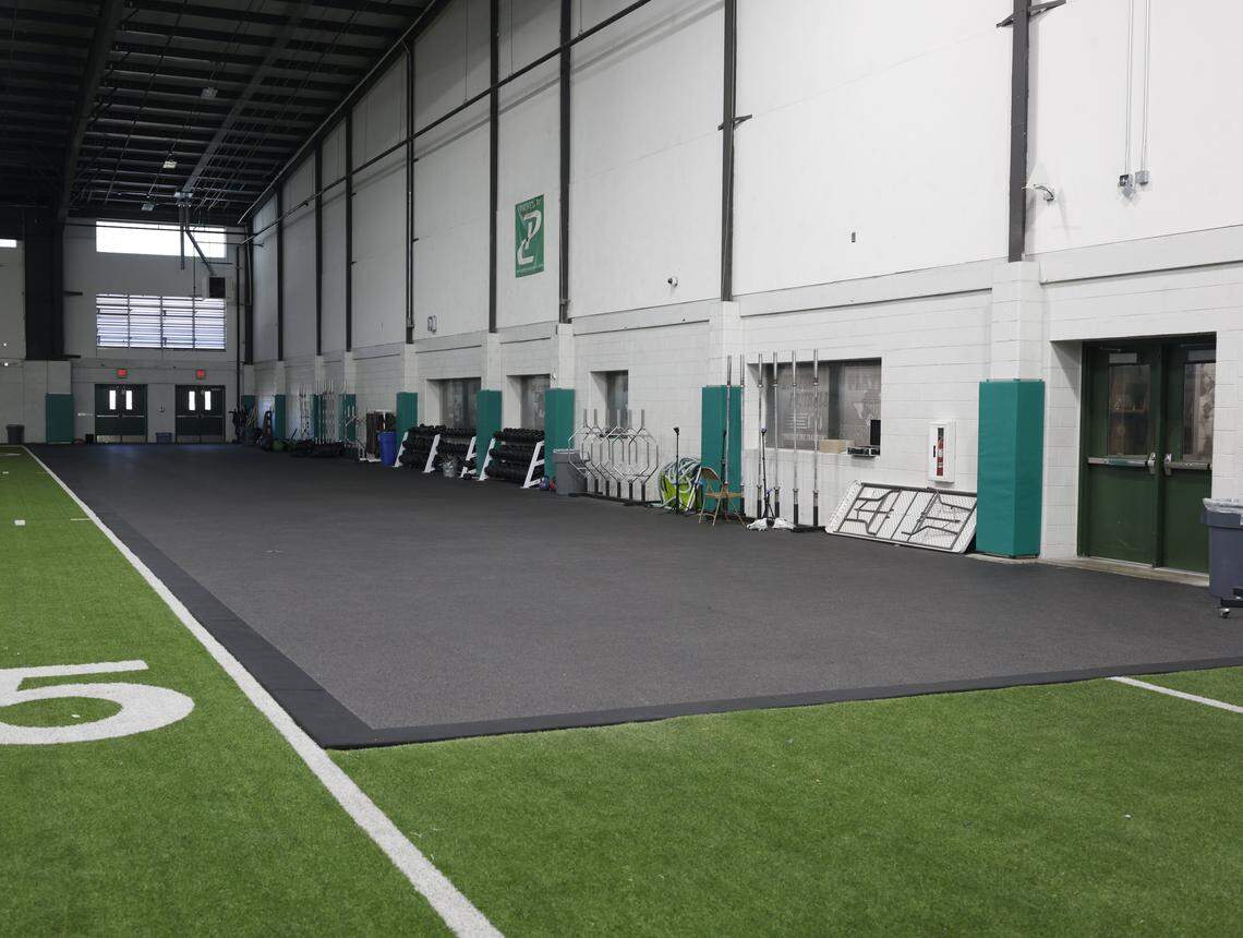 A black protective mat marks where more weights will be installed